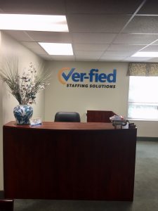 Ver-fied staffing solutions logo in office